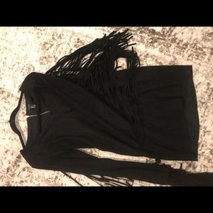 Gently used feaux suede dress with tassels on sleeves!